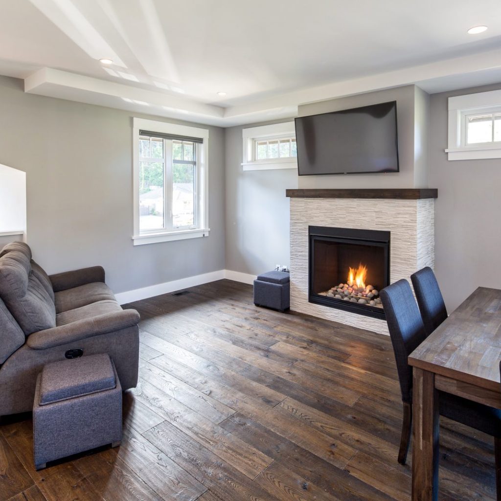 living room renovation features gas fireplace